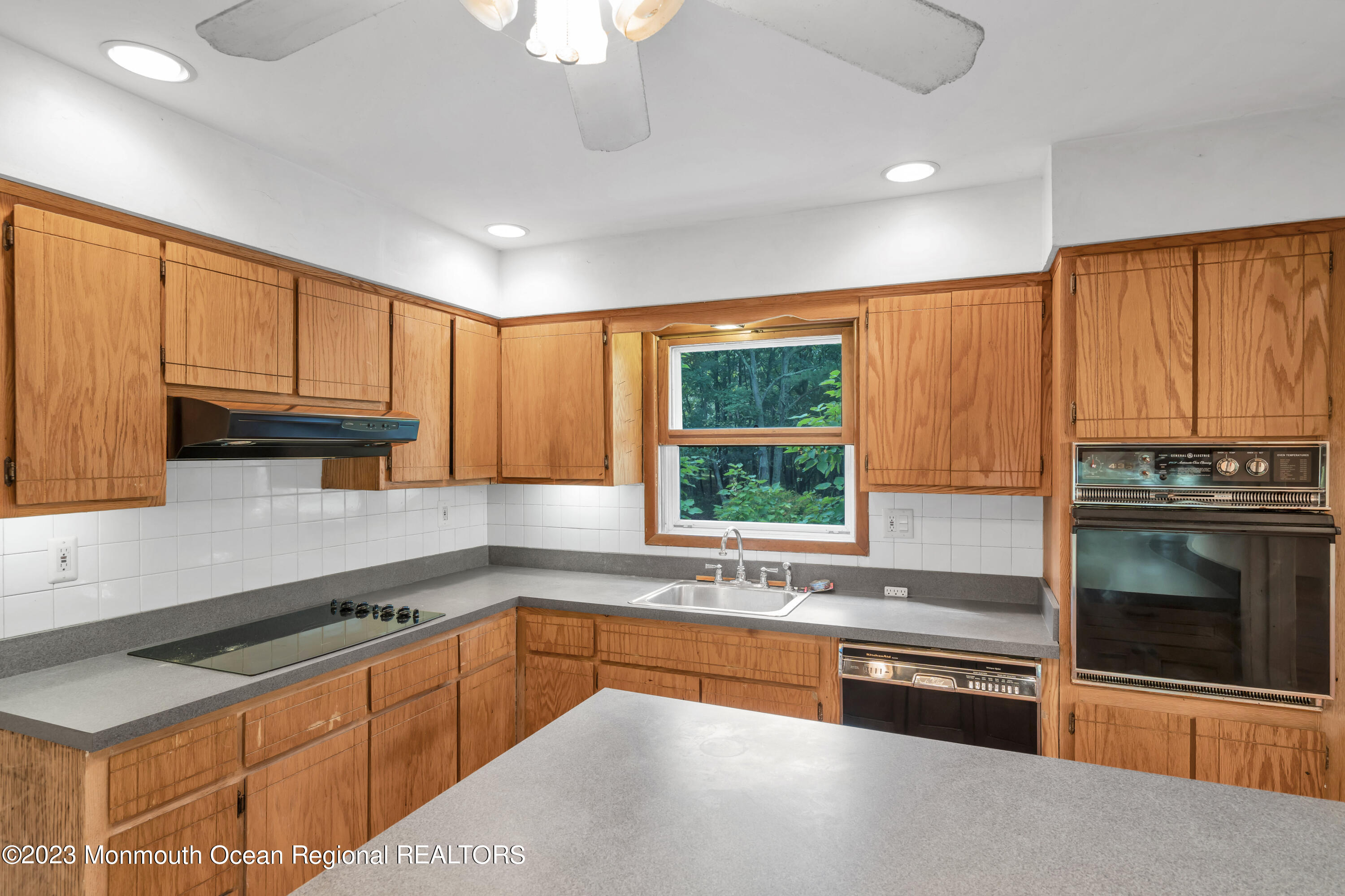 74 Willow Drive Jackson, NJ 08527 - Photo 4 of 20 a kitchen with stainless steel appliances granite countertop a sink stove and cabinets