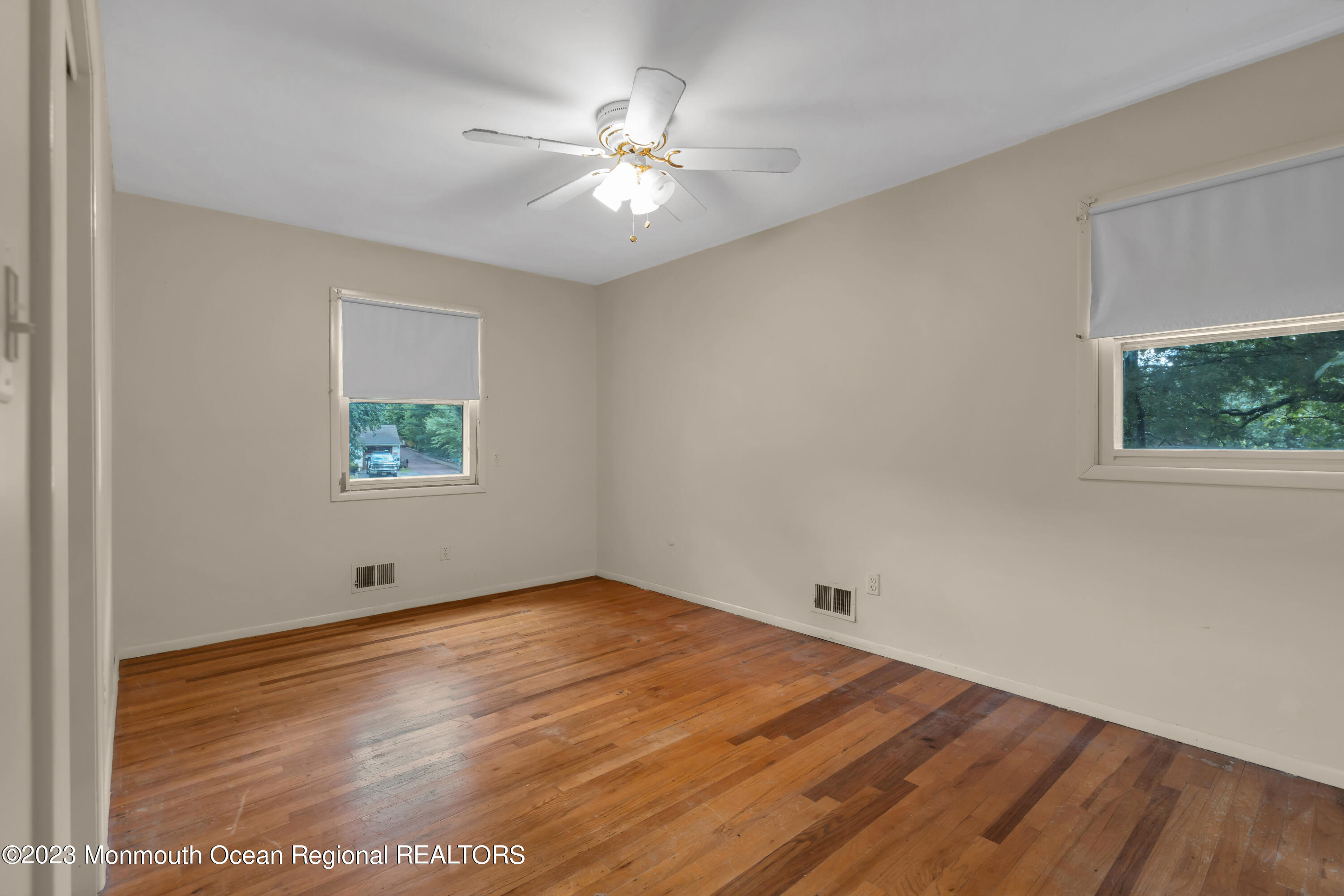 74 Willow Drive Jackson, NJ 08527 - Photo 9 of 20 wooden floor in an empty room with a window