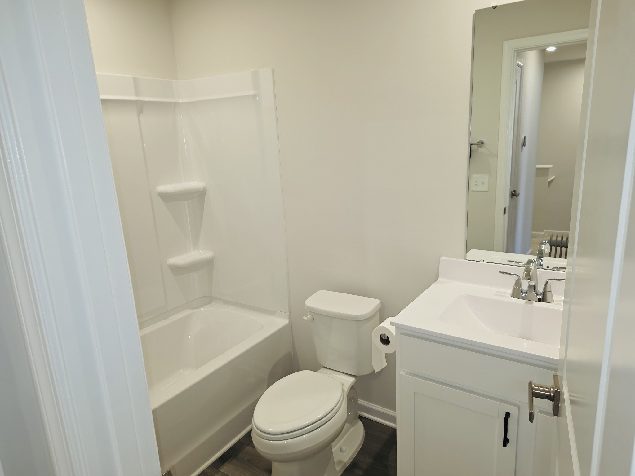 2112 Wisteria Loop Franklin, KY 42134 - Photo 11 of 14 a white toilet sitting next to a bathroom sink