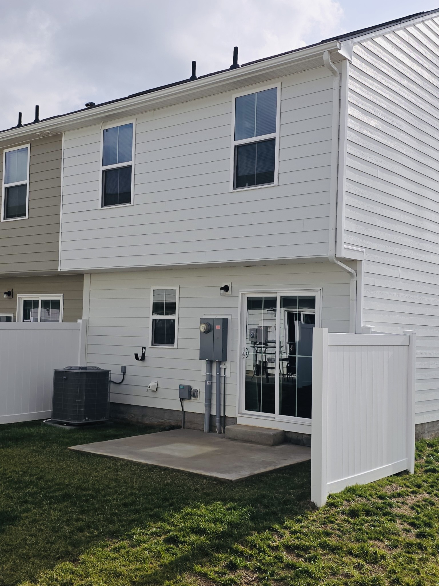 2112 Wisteria Loop Franklin, KY 42134 - Photo 14 of 14 a view of a white house with windows and yard