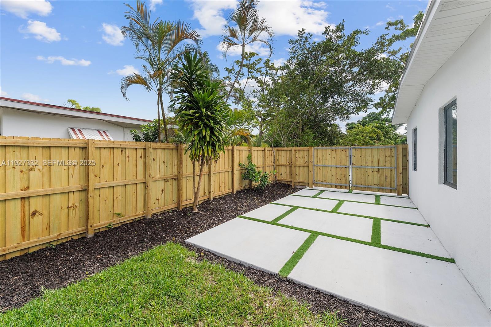 485 Northwest 132nd Street North Miami, FL 33168 - Photo 11 of 15 a view of a backyard with chairs