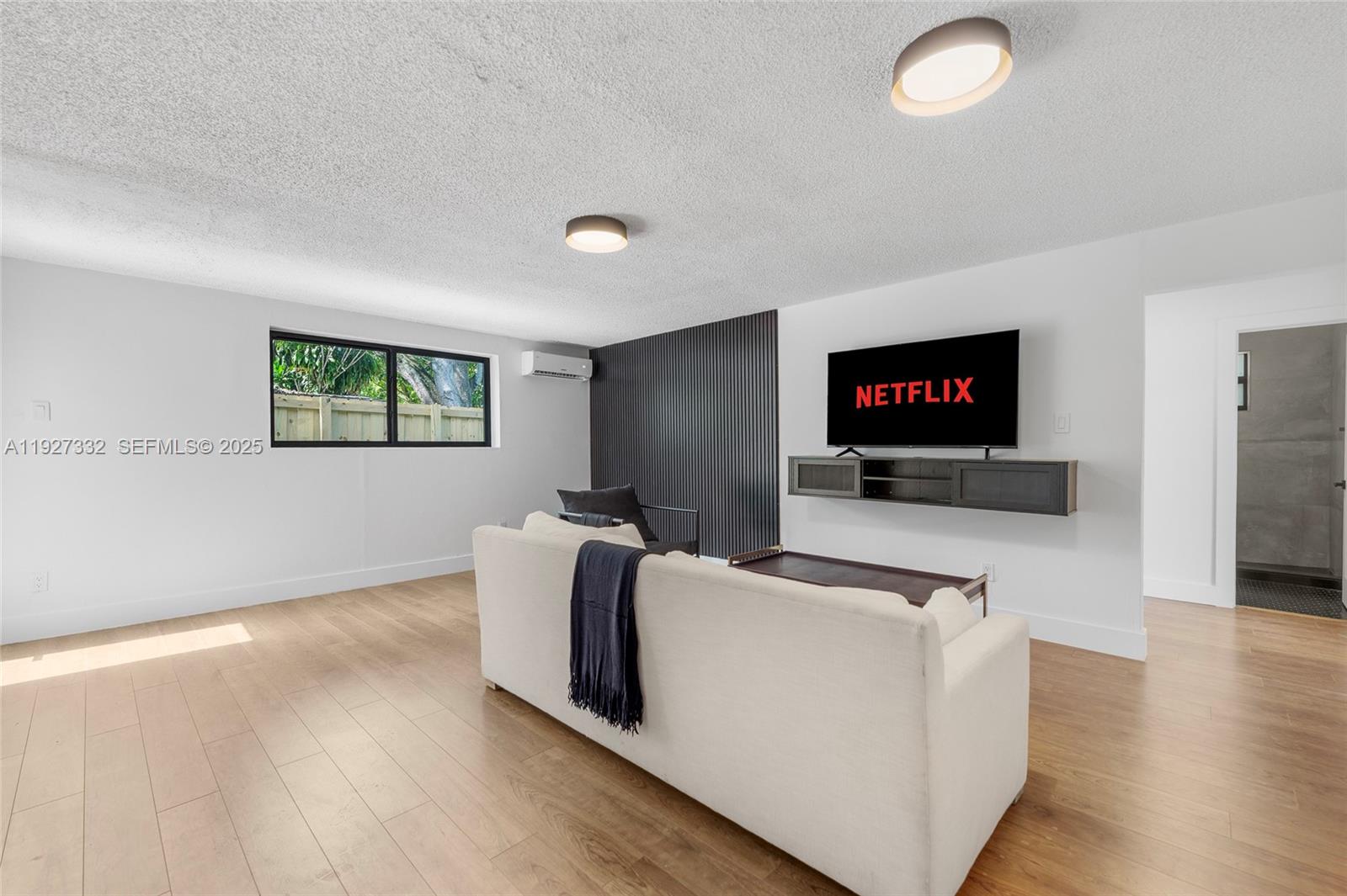 485 Northwest 132nd Street North Miami, FL 33168 - Photo 5 of 15 a living room with furniture and a flat screen tv