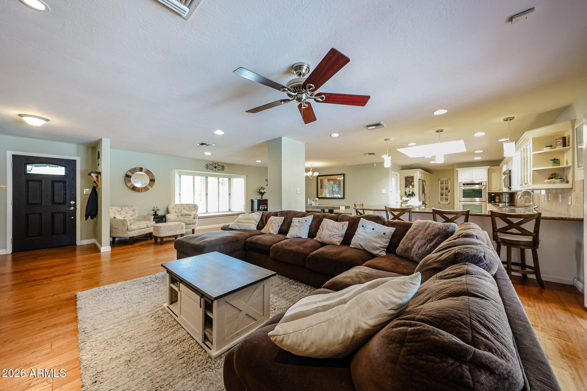 7113 North 8th Avenue Phoenix, AZ 85021 - Photo 12 of 57 a living room with furniture kitchen view and a table