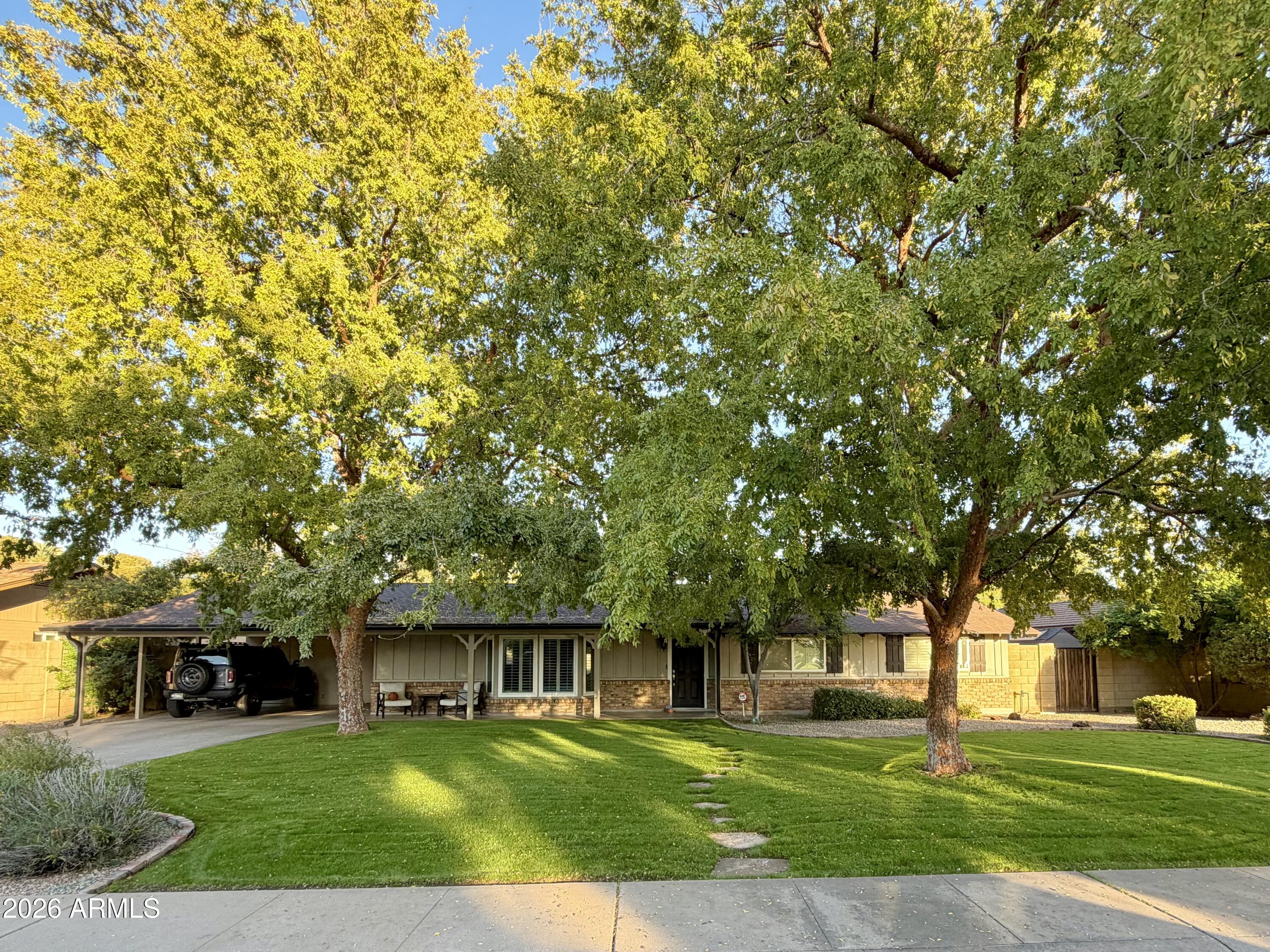 7113 North 8th Avenue Phoenix, AZ 85021 - Photo 2 of 57 a view of house with yard and green space