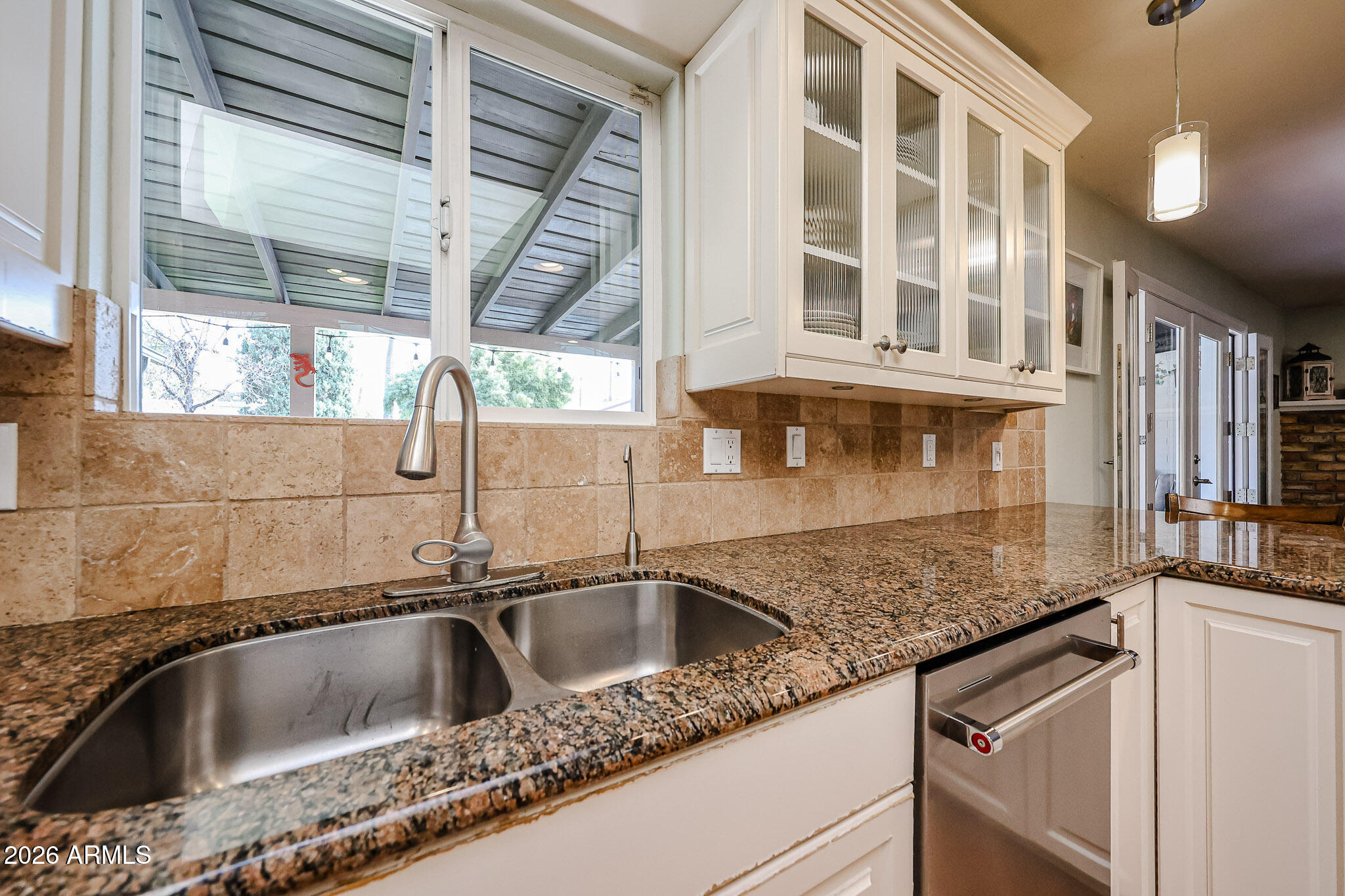 7113 North 8th Avenue Phoenix, AZ 85021 - Photo 24 of 57 a close view of a sink and a granite counter top a window