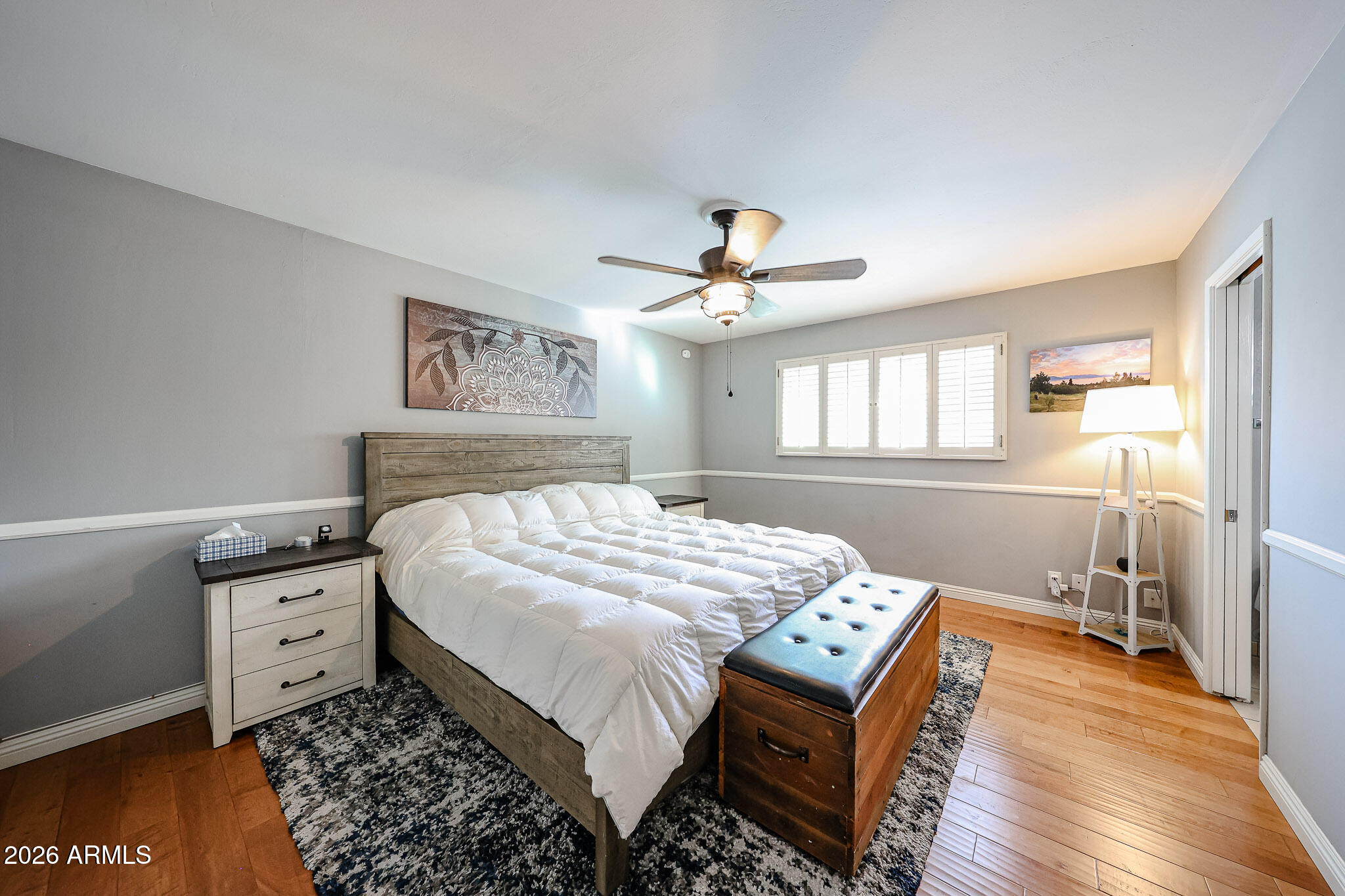 7113 North 8th Avenue Phoenix, AZ 85021 - Photo 28 of 57 a bedroom with a bed and a chandelier