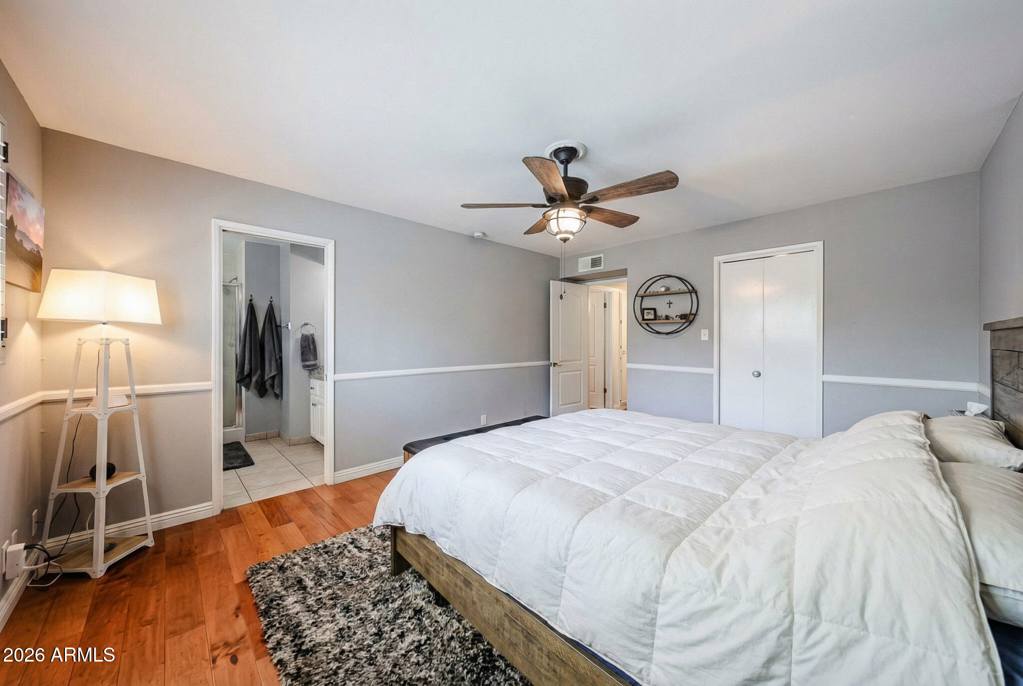 7113 North 8th Avenue Phoenix, AZ 85021 - Photo 30 of 57 a bedroom with a bed and a chandelier