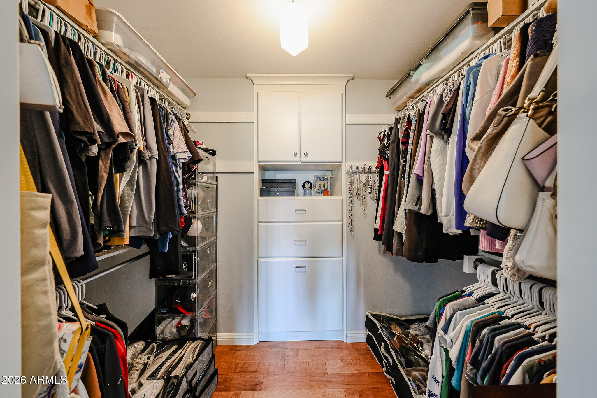 7113 North 8th Avenue Phoenix, AZ 85021 - Photo 31 of 57 a view of walk in closet with clothes and shoes