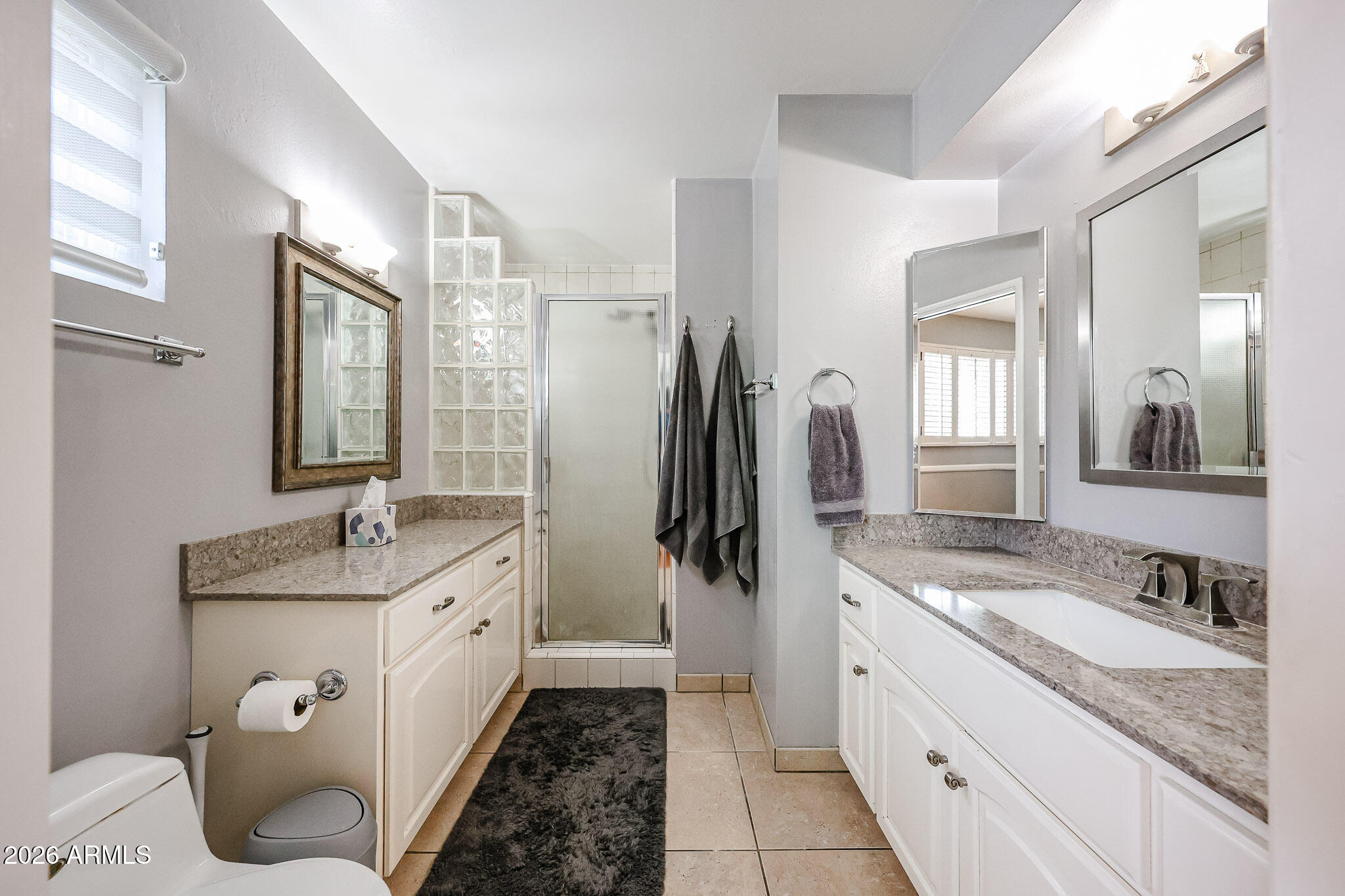 7113 North 8th Avenue Phoenix, AZ 85021 - Photo 32 of 57 a bathroom with a granite countertop sink toilet and shower