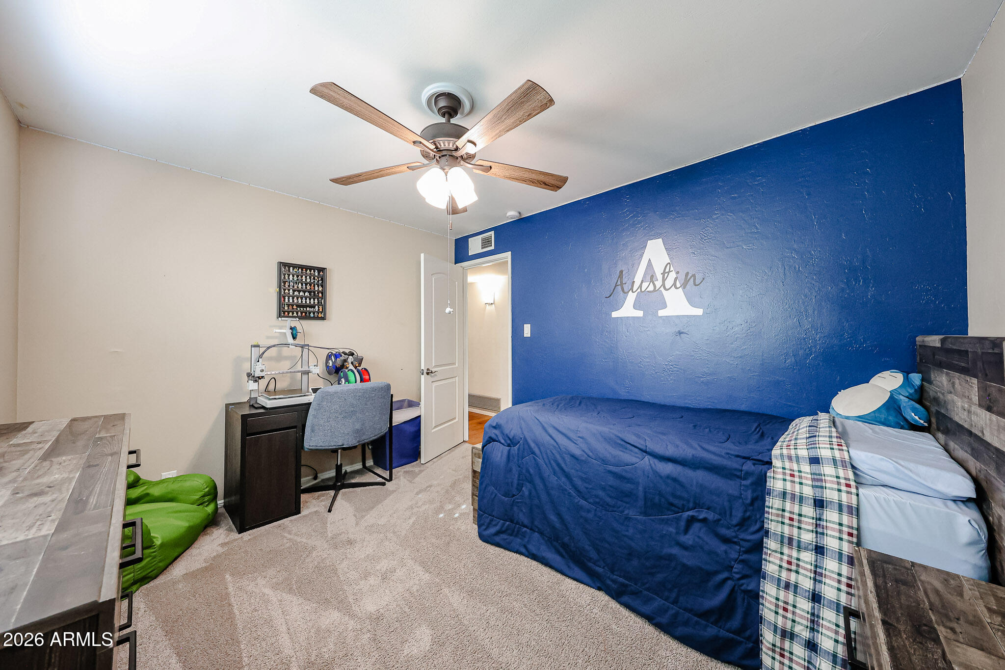 7113 North 8th Avenue Phoenix, AZ 85021 - Photo 36 of 57 a bedroom with a bed and a chandelier