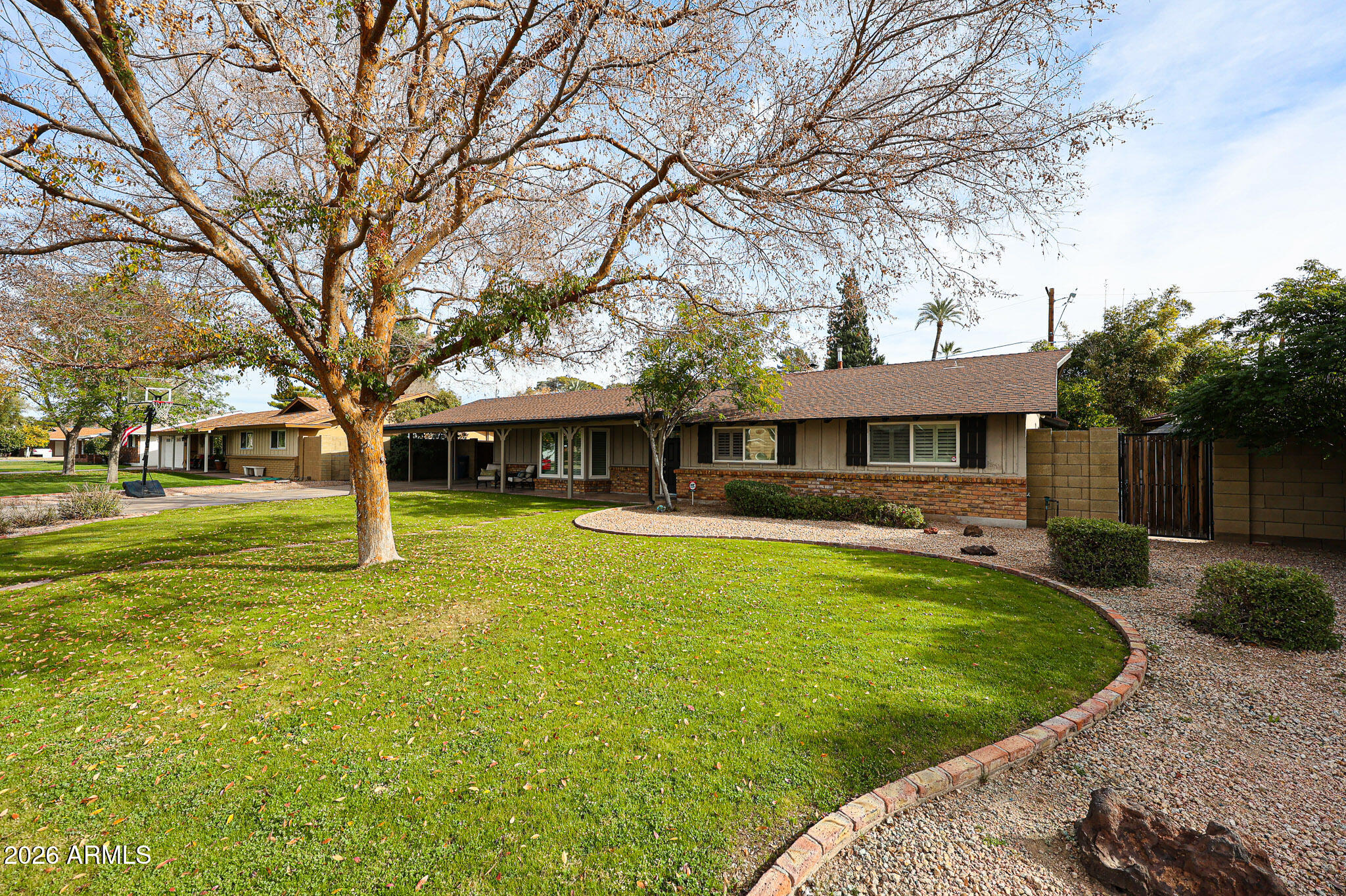 7113 North 8th Avenue Phoenix, AZ 85021 - Photo 4 of 57 a front view of a house with a yard