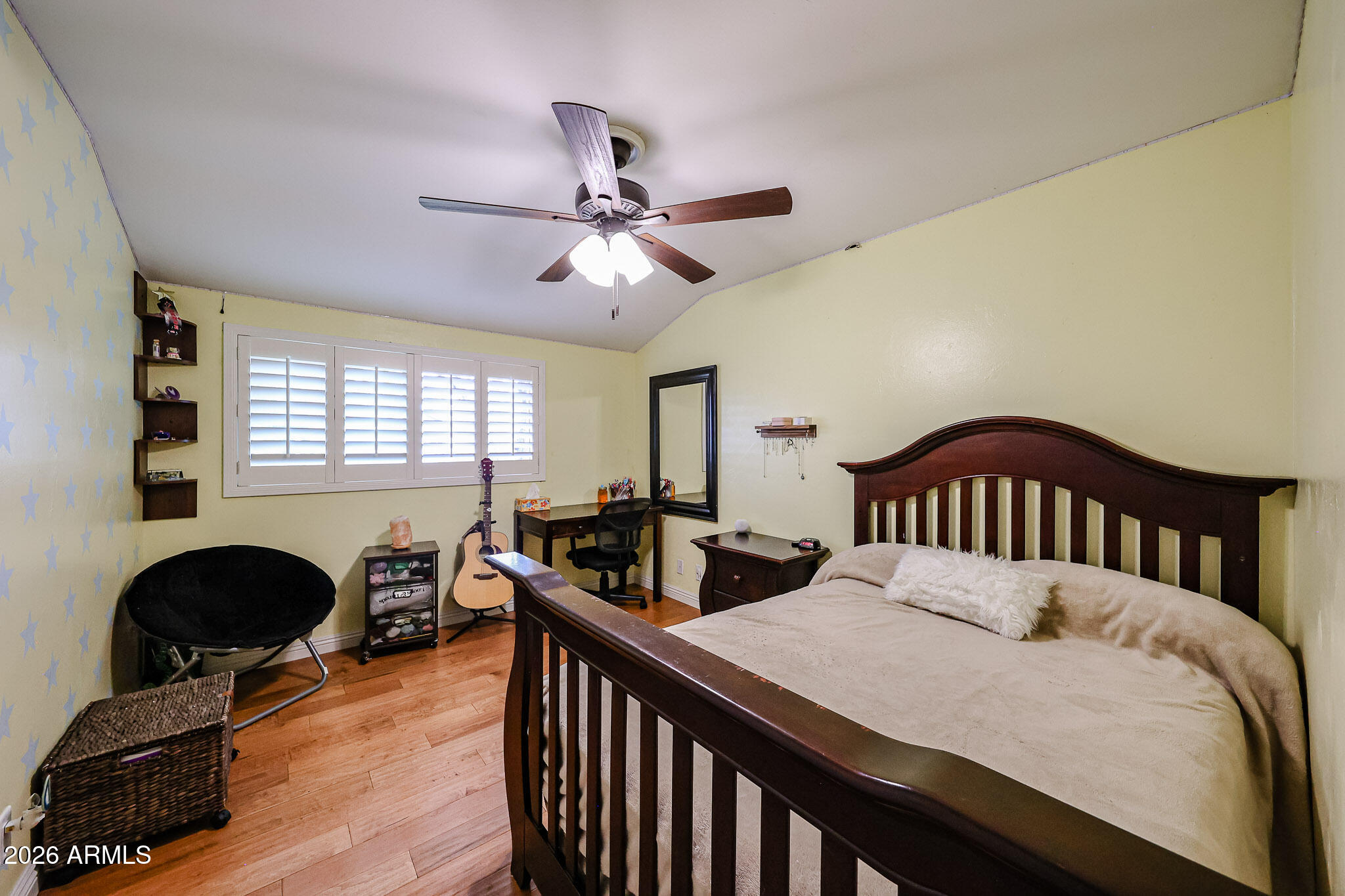 7113 North 8th Avenue Phoenix, AZ 85021 - Photo 41 of 57 a bedroom with a bed and a chandelier