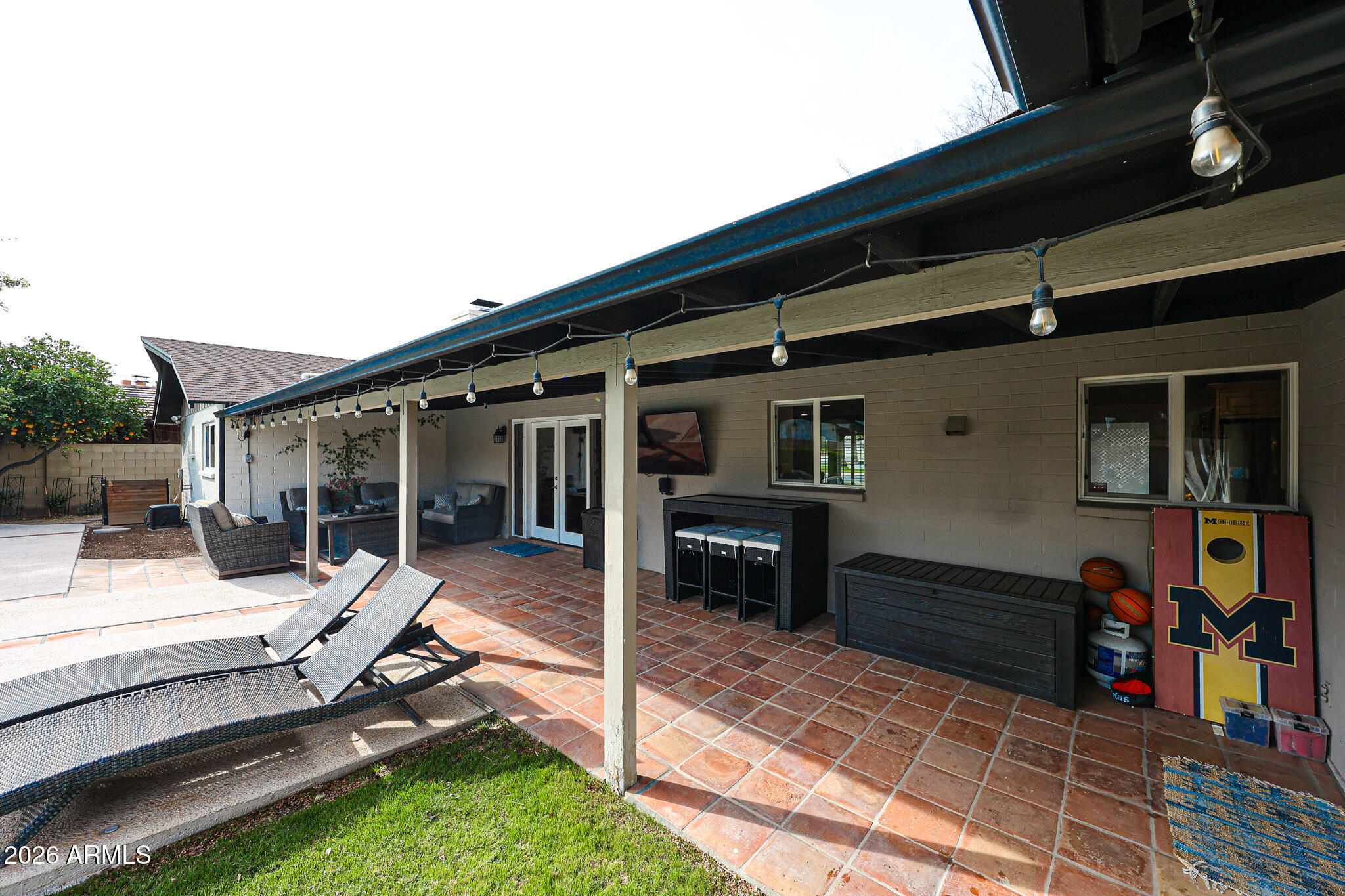 7113 North 8th Avenue Phoenix, AZ 85021 - Photo 47 of 57 a view of a house with backyard porch and furniture