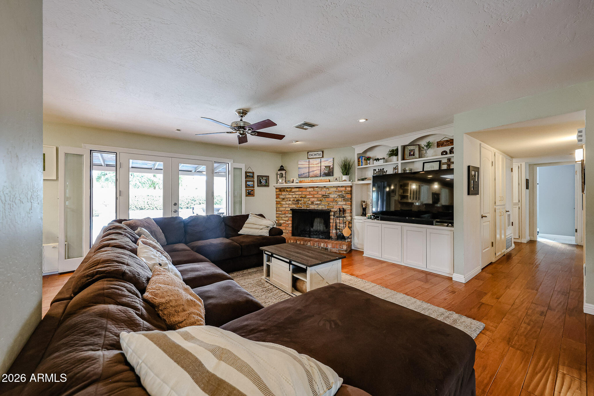 7113 North 8th Avenue Phoenix, AZ 85021 - Photo 9 of 57 a living room with furniture and a fireplace