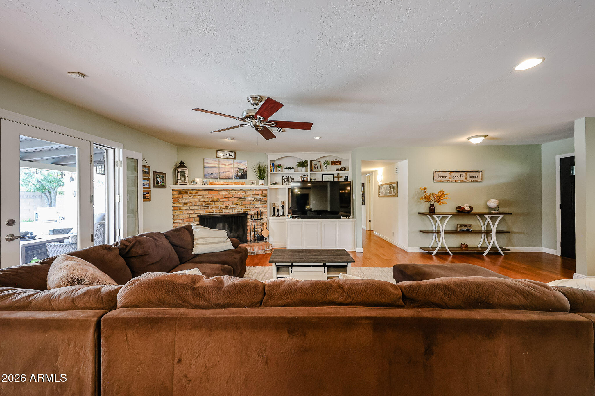 7113 North 8th Avenue Phoenix, AZ 85021 - Photo 10 of 57 a living room with furniture and a fireplace