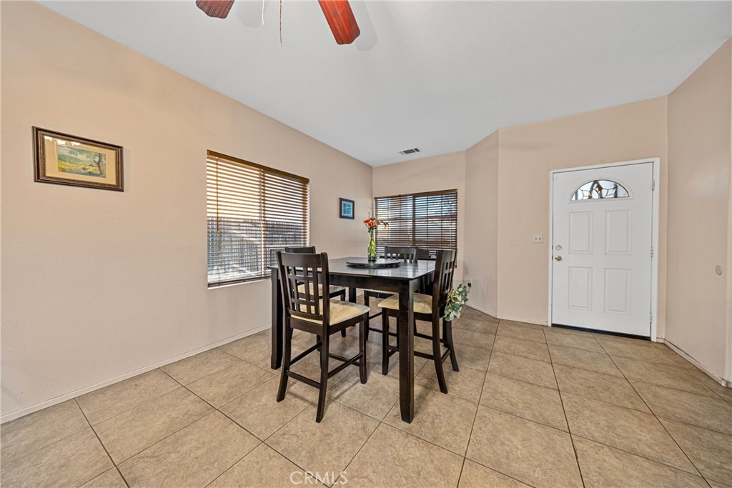 1727 Miranda Lane Beaumont, CA 92223 - Photo 11 of 47 a dining room with furniture and window