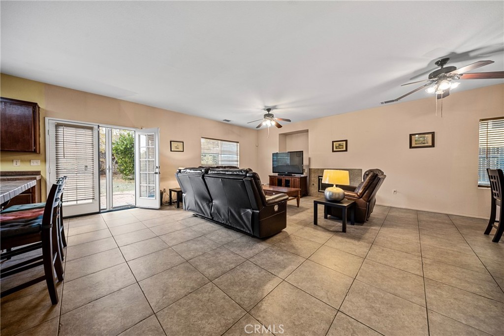 1727 Miranda Lane Beaumont, CA 92223 - Photo 13 of 47 a living room with furniture and a flat screen tv