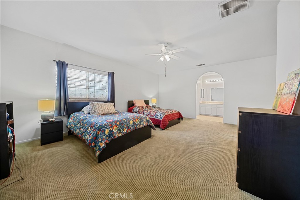 1727 Miranda Lane Beaumont, CA 92223 - Photo 18 of 47 a bedroom with a bed and window