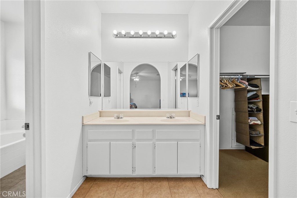1727 Miranda Lane Beaumont, CA 92223 - Photo 21 of 47 a bathroom with a double vanity sink and a mirror