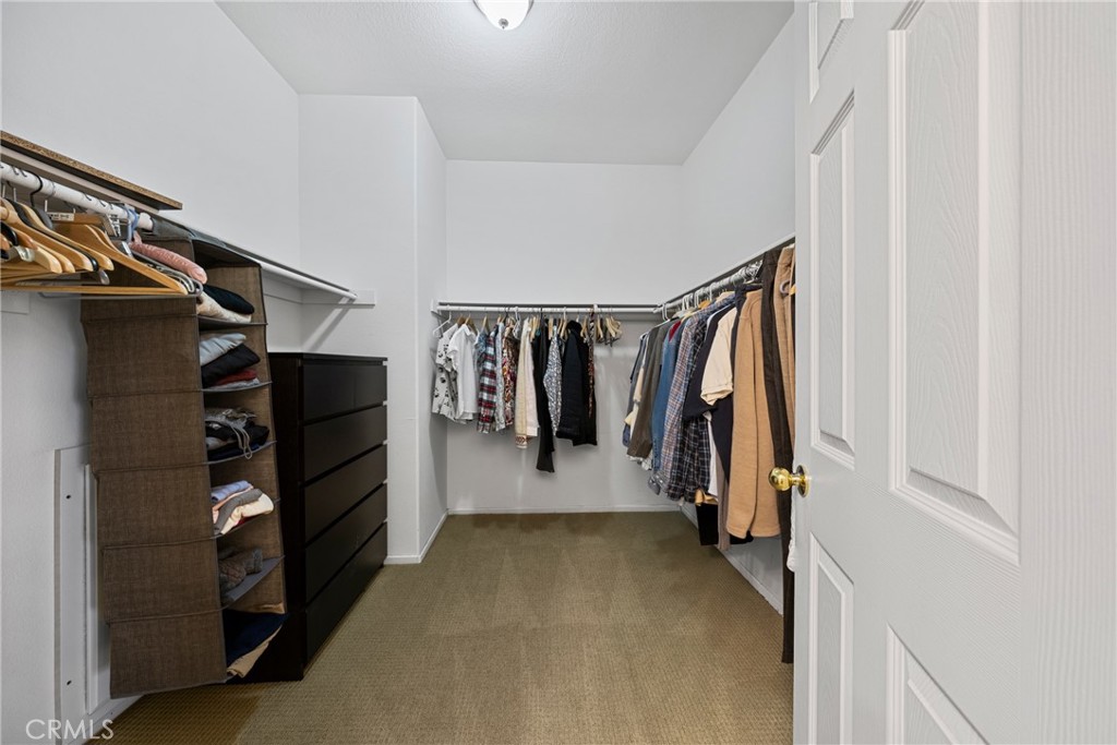 1727 Miranda Lane Beaumont, CA 92223 - Photo 23 of 47 a view of walk in closet with clothes