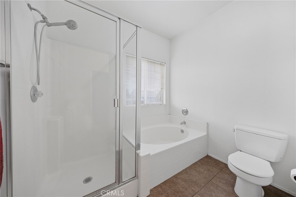 1727 Miranda Lane Beaumont, CA 92223 - Photo 24 of 47 a white toilet sitting next to a bath tub