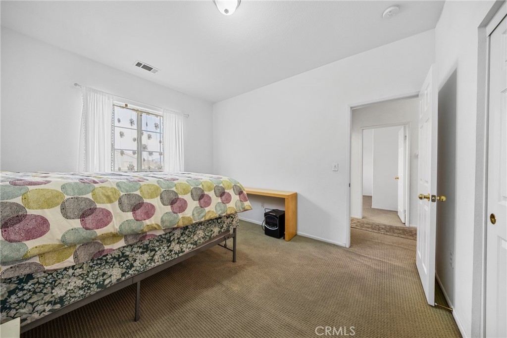 1727 Miranda Lane Beaumont, CA 92223 - Photo 26 of 47 a bedroom with a bed and a window
