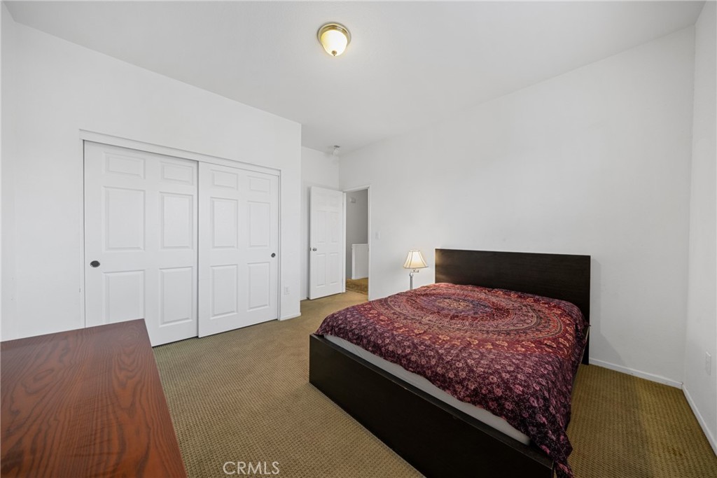 1727 Miranda Lane Beaumont, CA 92223 - Photo 30 of 47 a bedroom with a bed and a night stand