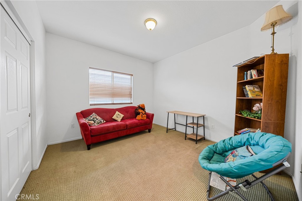 1727 Miranda Lane Beaumont, CA 92223 - Photo 32 of 47 a living room with furniture and a window