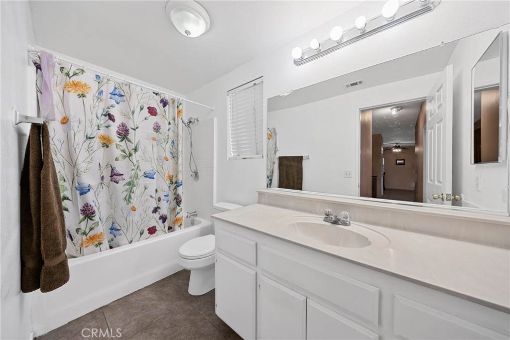 1727 Miranda Lane Beaumont, CA 92223 - Photo 38 of 47 a bathroom with a sink and a mirror