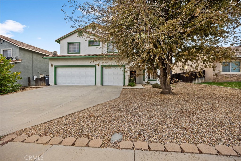 1727 Miranda Lane Beaumont, CA 92223 - Photo 47 of 47 a front view of a house with a yard and garage