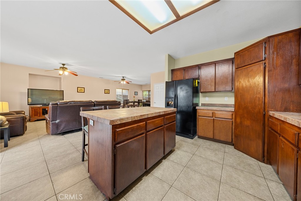 1727 Miranda Lane Beaumont, CA 92223 - Photo 8 of 47 a kitchen with stainless steel appliances granite countertop a stove refrigerator and cabinets