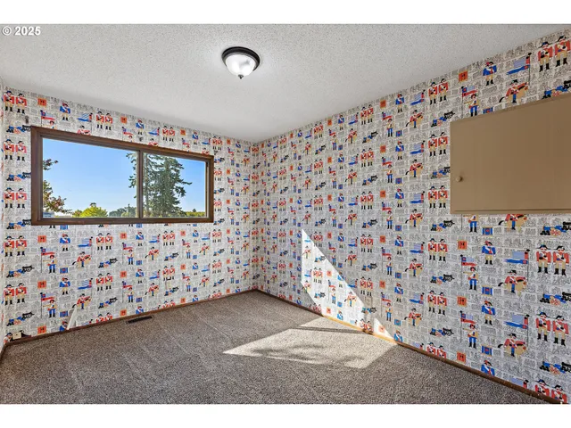 a view of a room with toys and wooden floor