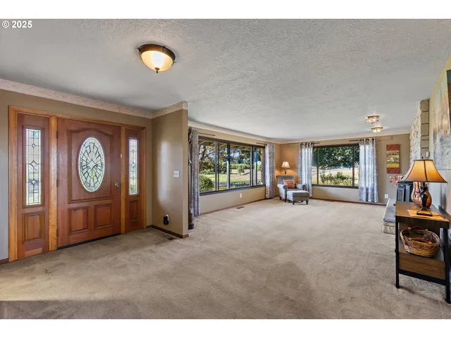 a view of a livingroom with furniture and window