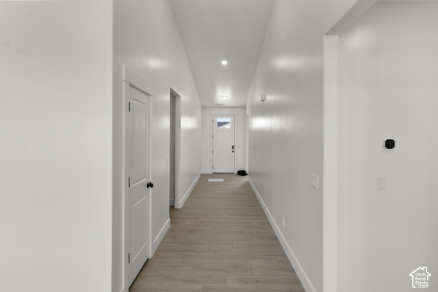 205 East 690th Street North Logan, UT 84321 - Photo 37 of 52 Recessed ceiling lighting, wood-finish flooring, white interior doors, and a front entry door with decorative glass