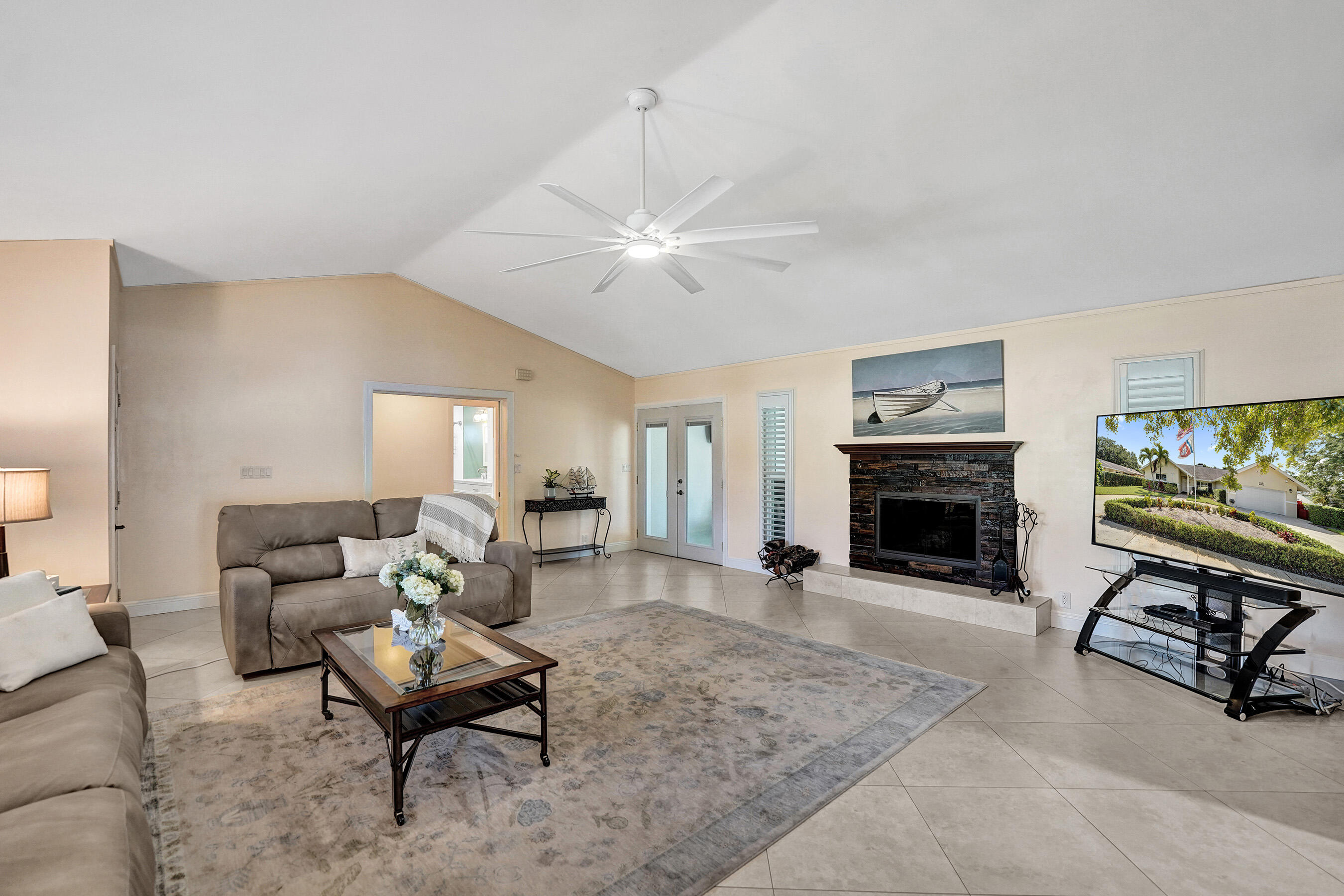 5181 Southwest 89th Terrace Cooper City, FL 33328 - Photo 11 of 56 a living room with furniture a fireplace and a flat screen tv