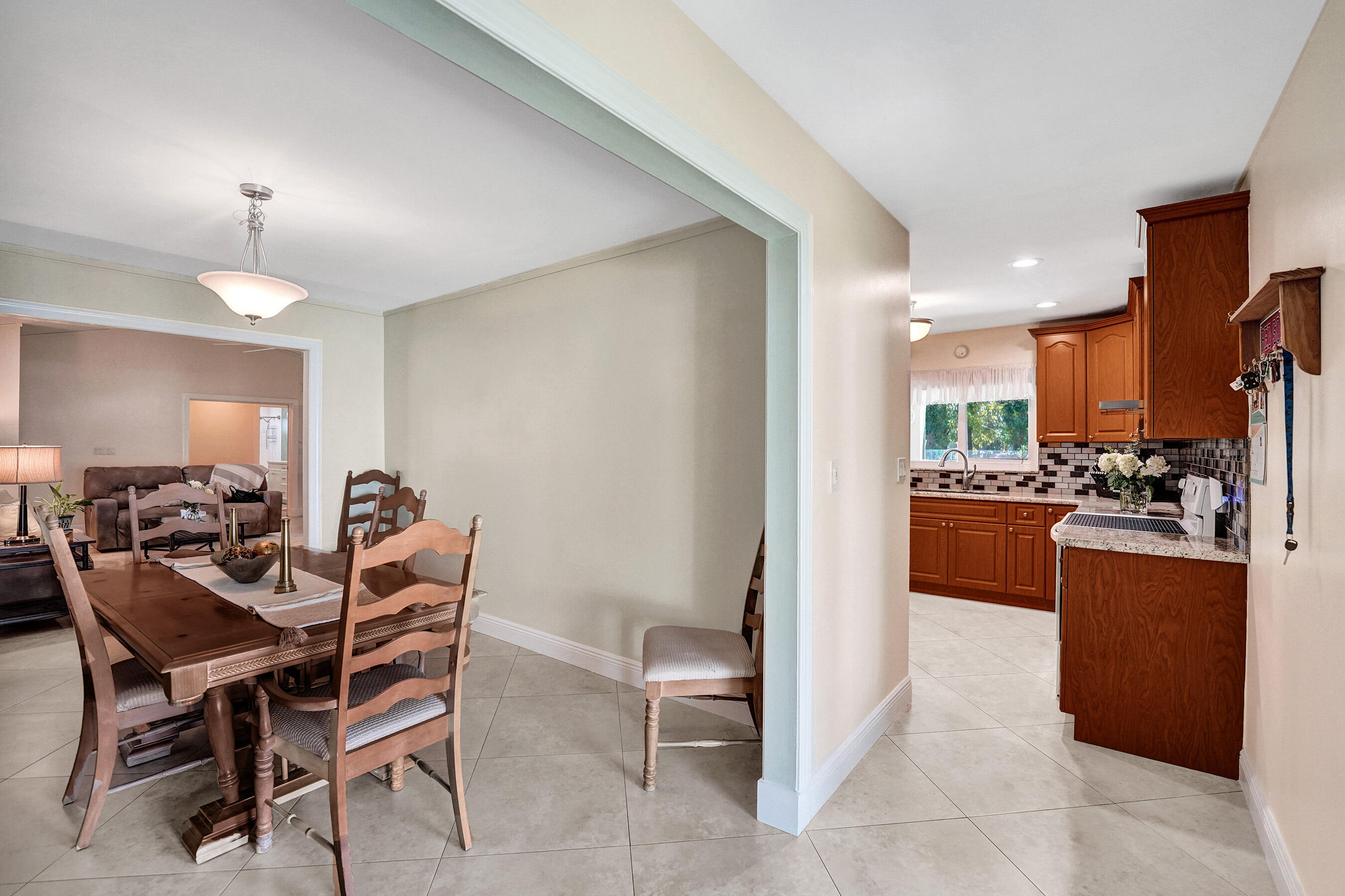 5181 Southwest 89th Terrace Cooper City, FL 33328 - Photo 13 of 56 a view of a dining room with furniture and a chandelier
