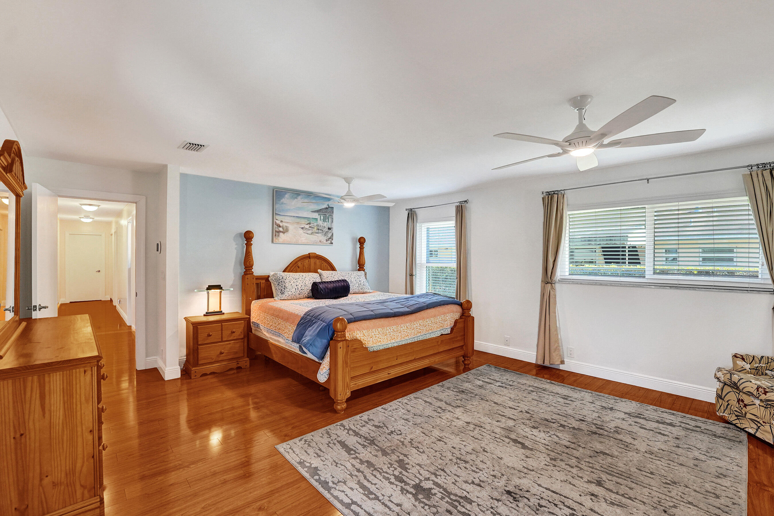 5181 Southwest 89th Terrace Cooper City, FL 33328 - Photo 21 of 56 a bedroom with a bed and wooden floor