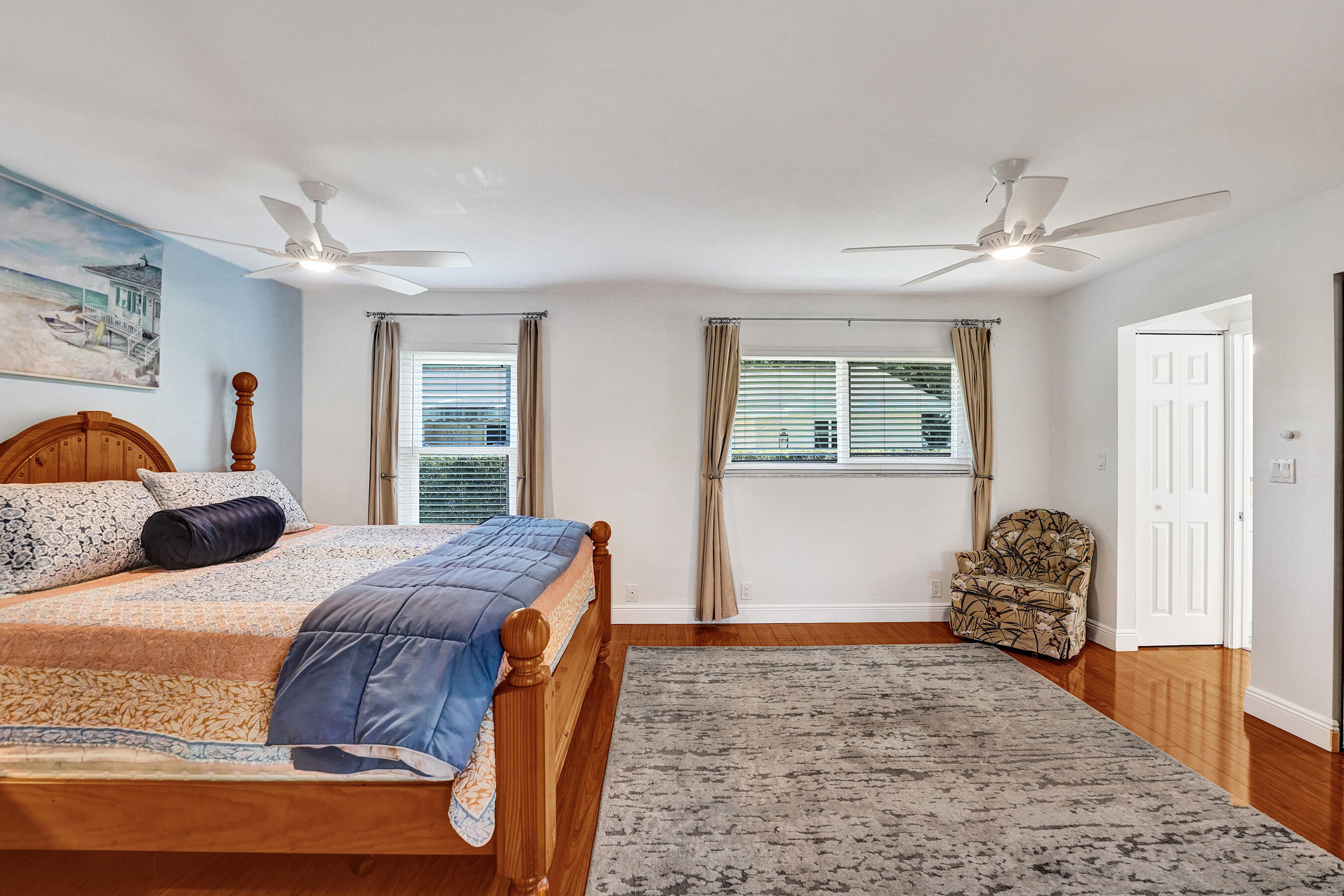 5181 Southwest 89th Terrace Cooper City, FL 33328 - Photo 23 of 56 a bedroom with a bed and wooden floor