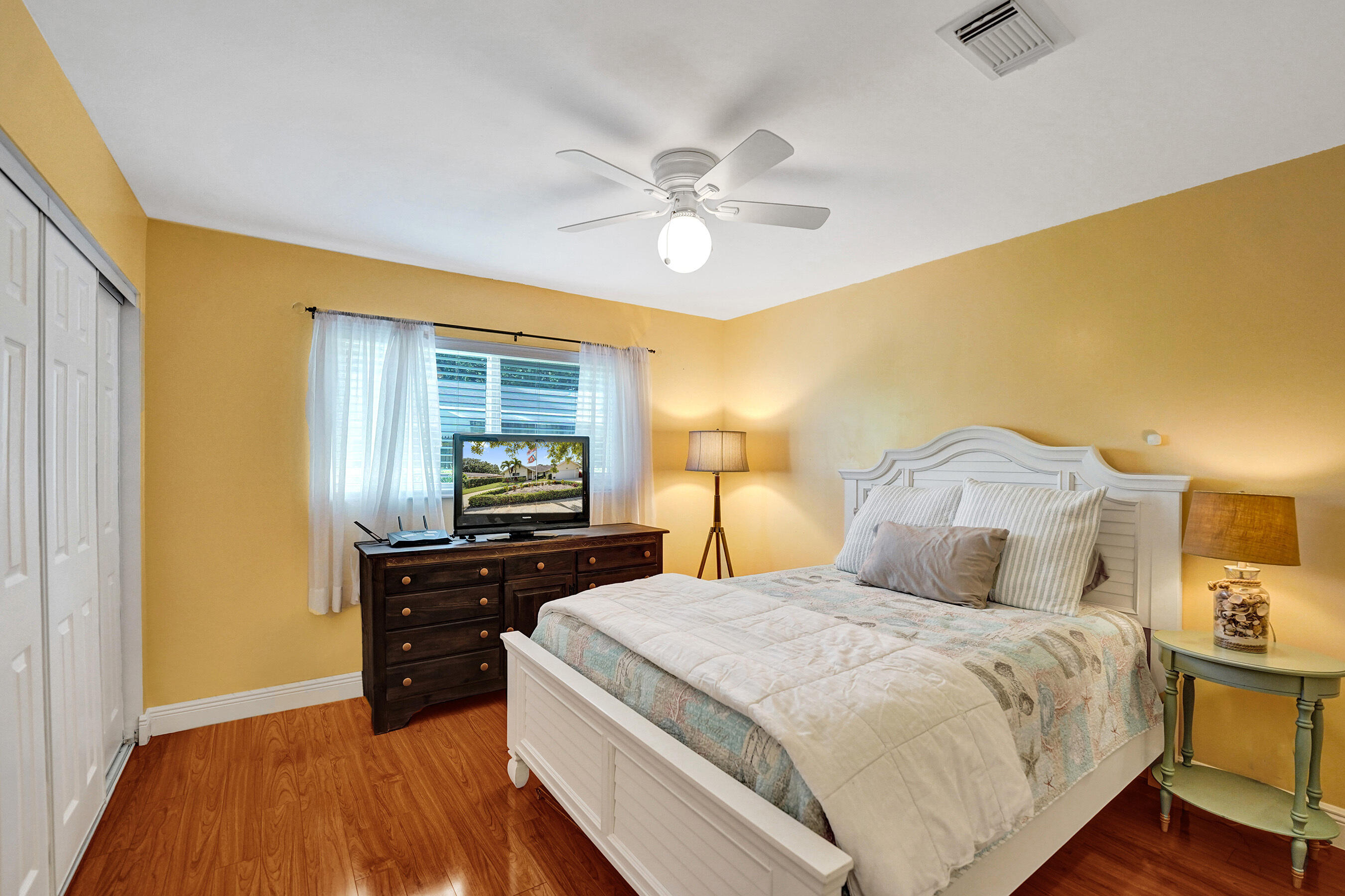 5181 Southwest 89th Terrace Cooper City, FL 33328 - Photo 27 of 56 a bedroom with a bed and wooden floor