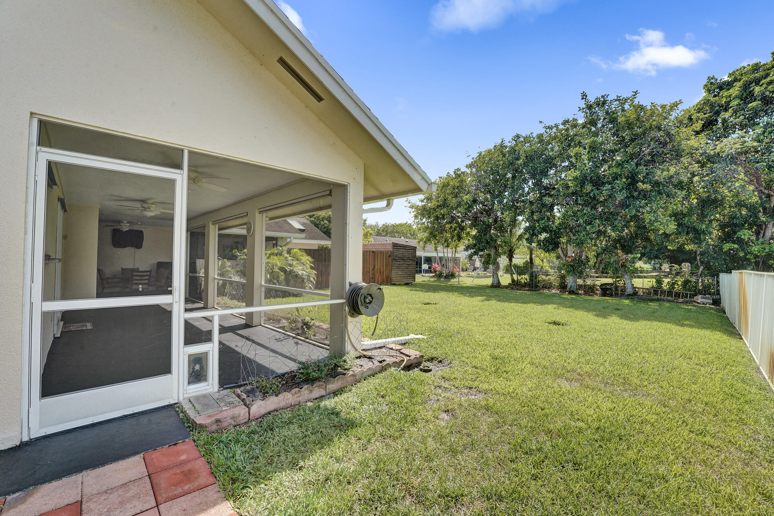 5181 Southwest 89th Terrace Cooper City, FL 33328 - Photo 35 of 56 a view of a house with backyard and trees