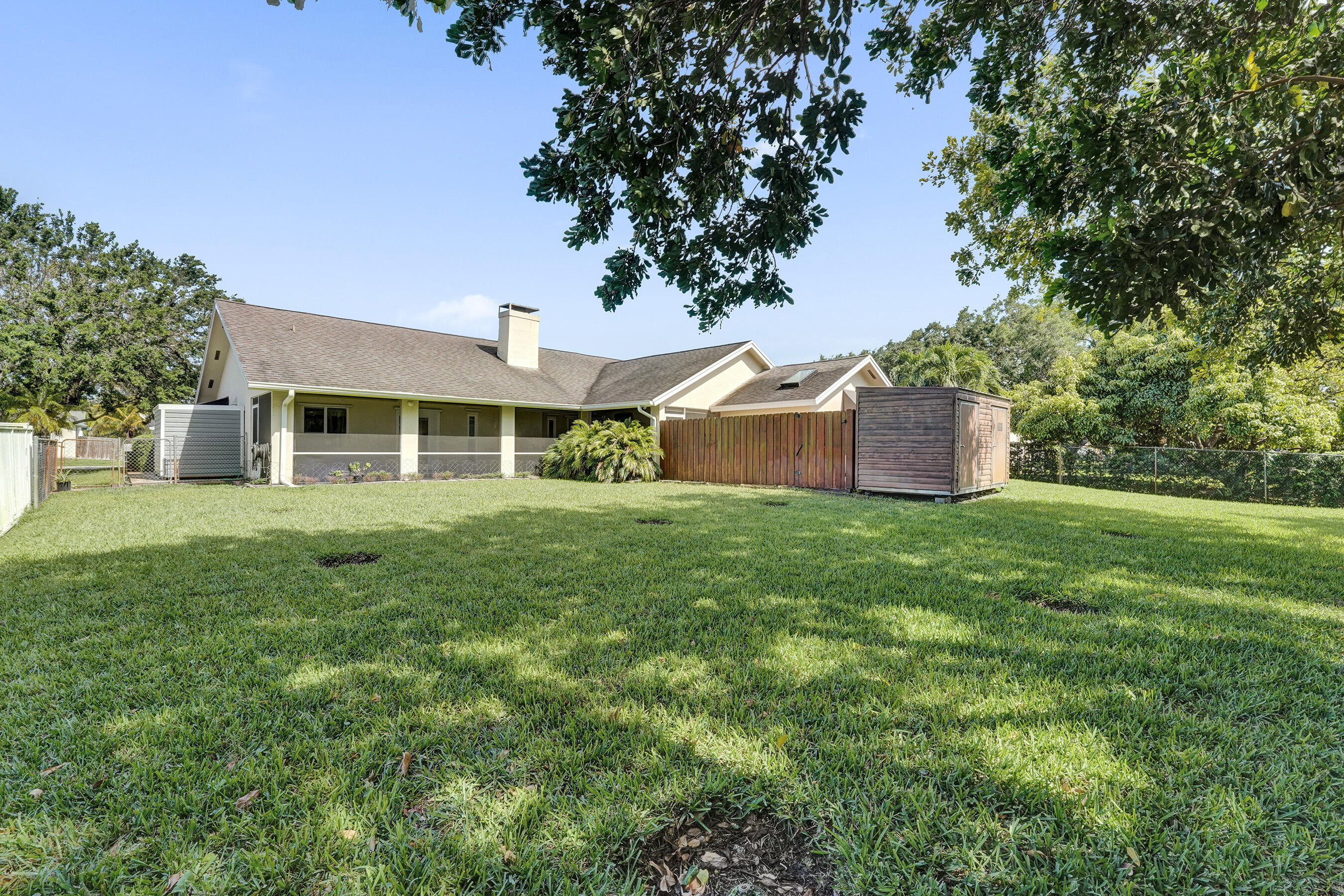 5181 Southwest 89th Terrace Cooper City, FL 33328 - Photo 40 of 56 a front view of a house with a garden
