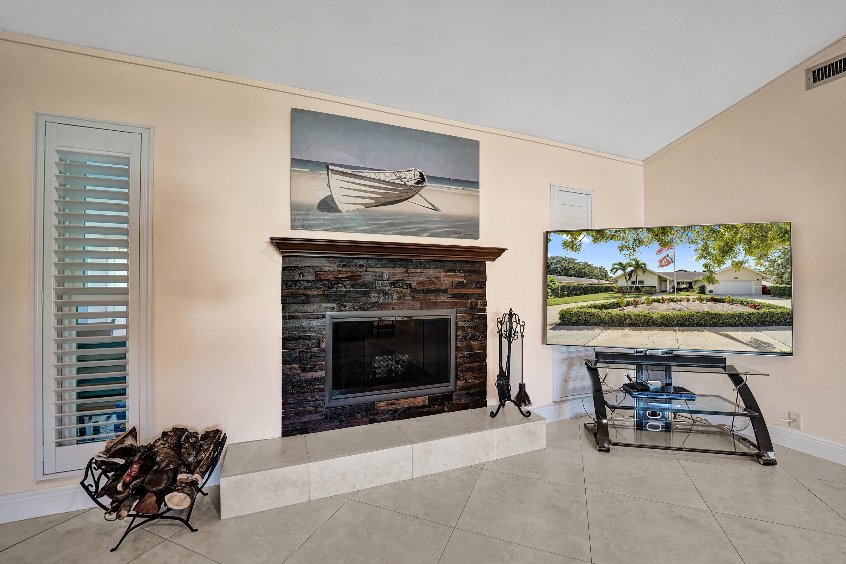 5181 Southwest 89th Terrace Cooper City, FL 33328 - Photo 8 of 56 a living room with furniture a fireplace and a flat screen tv