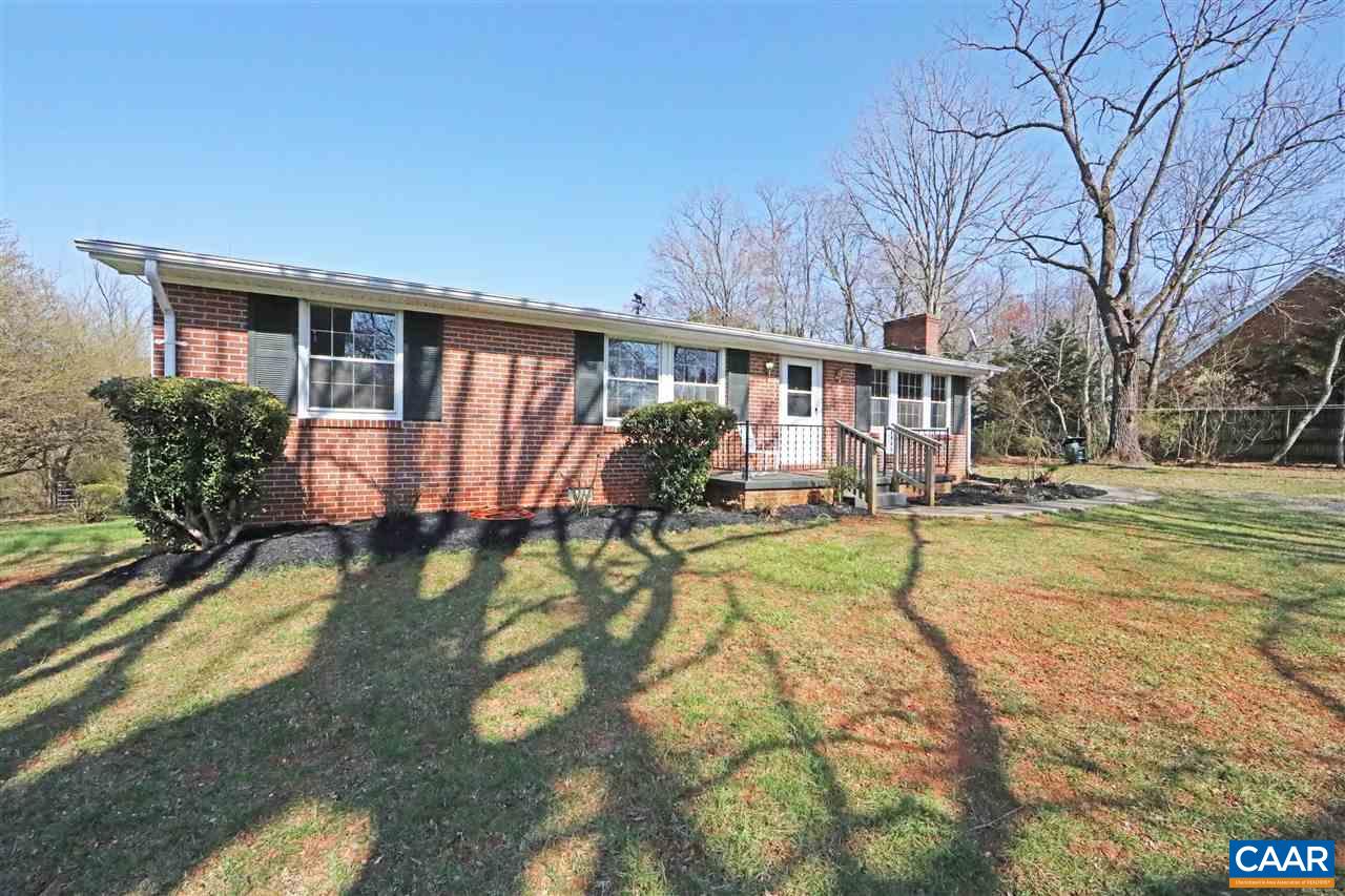 869 Black Cat Road Keswick, VA 22947 - Photo 1 of 20 a view of a house with backyard porch and sitting area