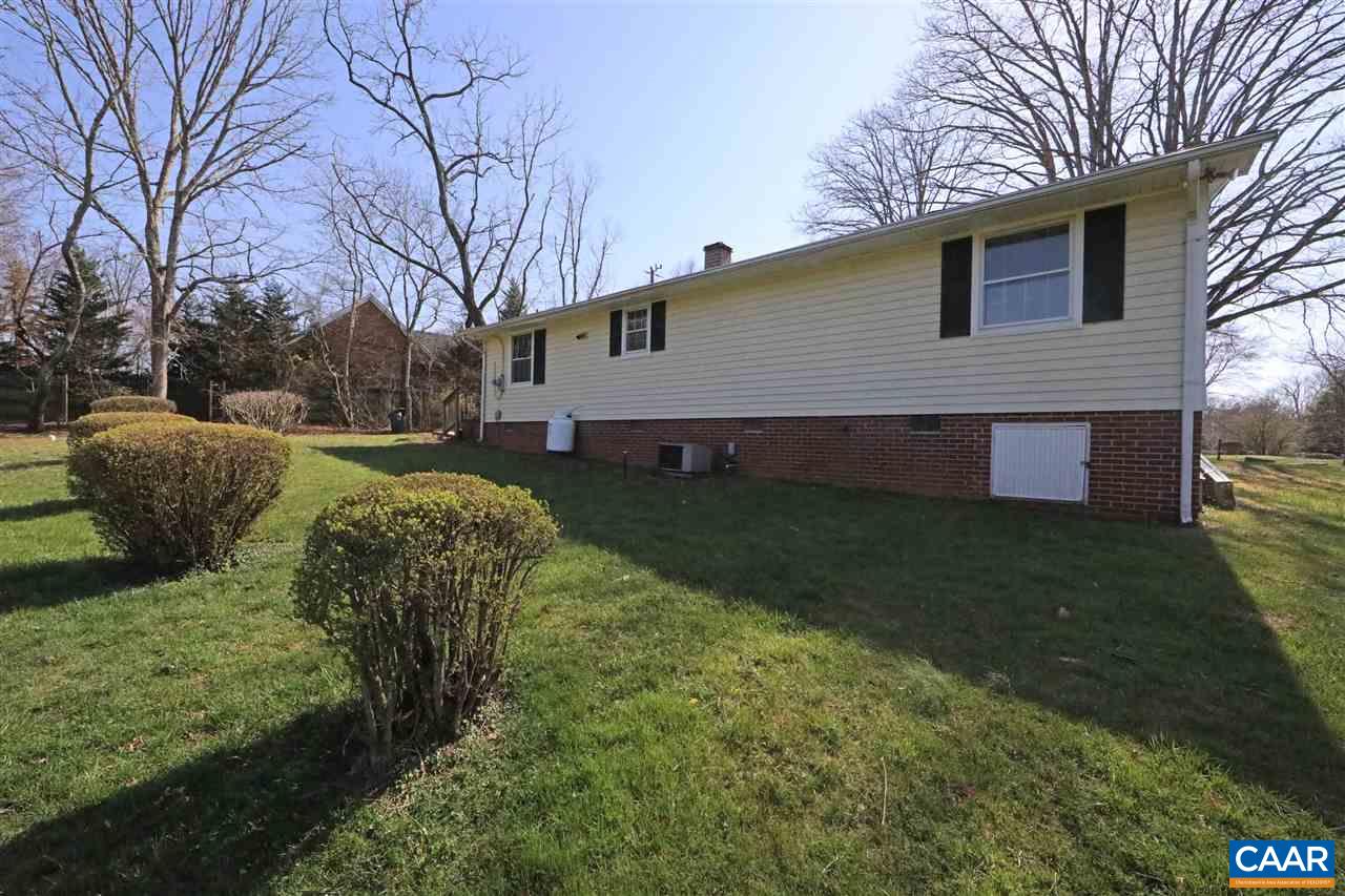 869 Black Cat Road Keswick, VA 22947 - Photo 14 of 20 a view of a house with a yard