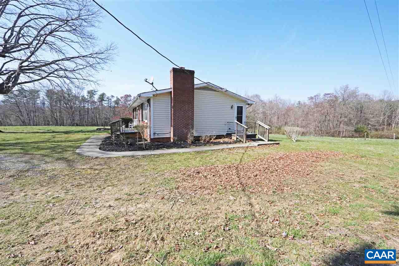 869 Black Cat Road Keswick, VA 22947 - Photo 17 of 20 a view of a house with a yard