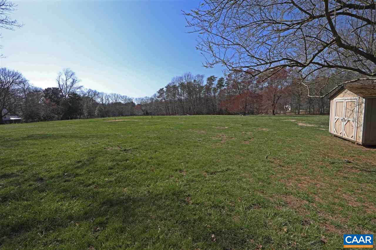 869 Black Cat Road Keswick, VA 22947 - Photo 18 of 20 a view of a field of grass and trees