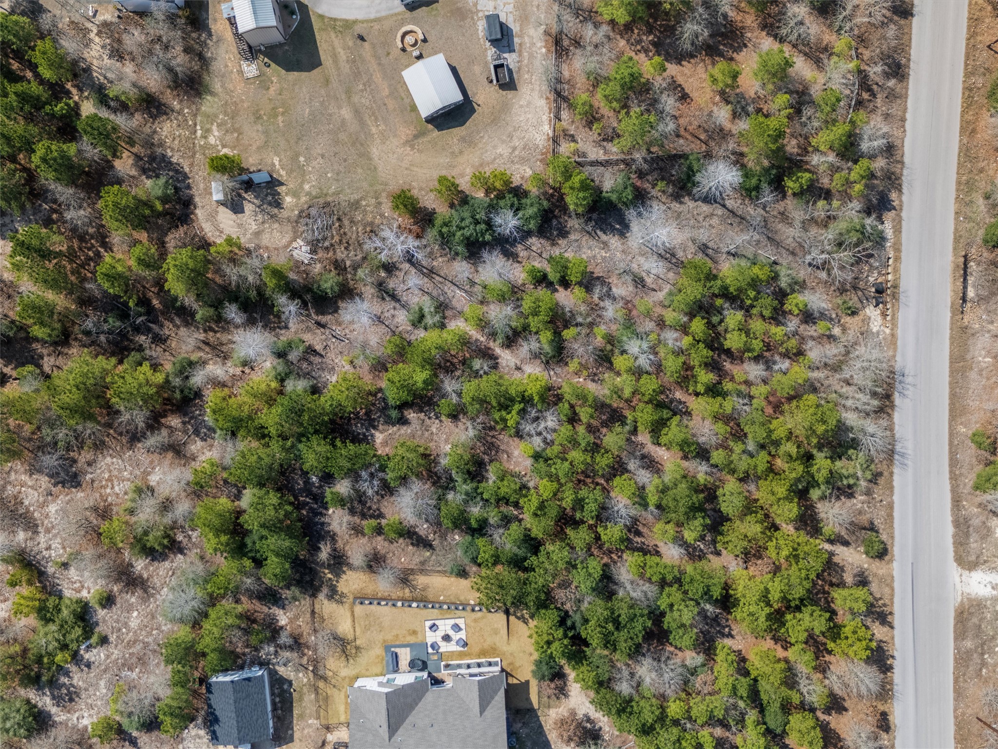 Tbd Cardinal Drive Paige, TX 78659 - Photo 2 of 14 an aerial view of residential house with outdoor space and trees all around