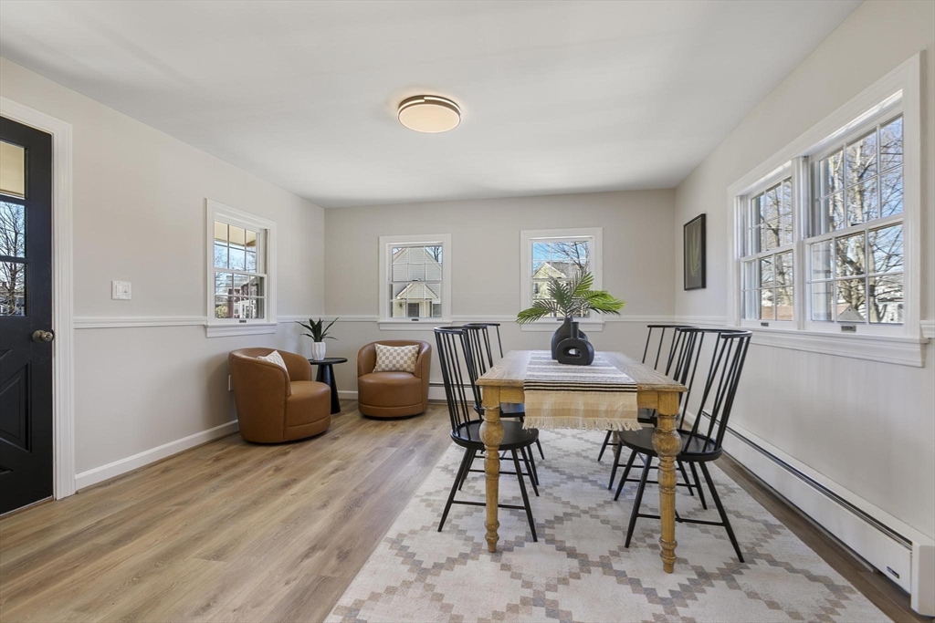 8 Crosby Road Reading, MA 01867 - Photo 14 of 30 a view of a dining room with furniture window and wooden floor