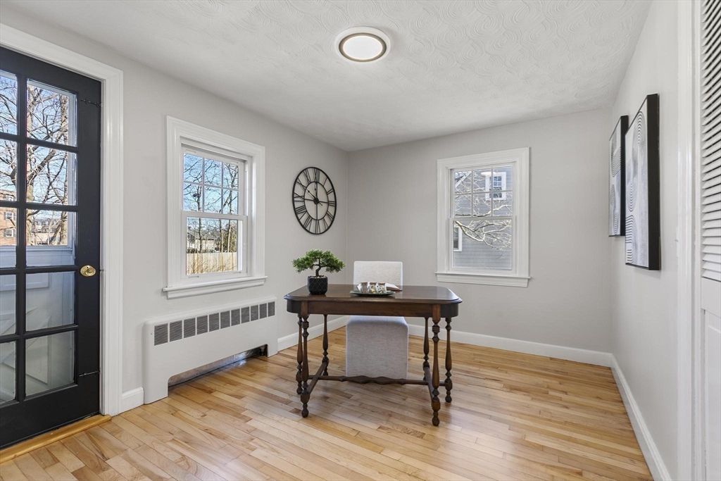 8 Crosby Road Reading, MA 01867 - Photo 16 of 30 a view of a workspace with wooden floor and a window