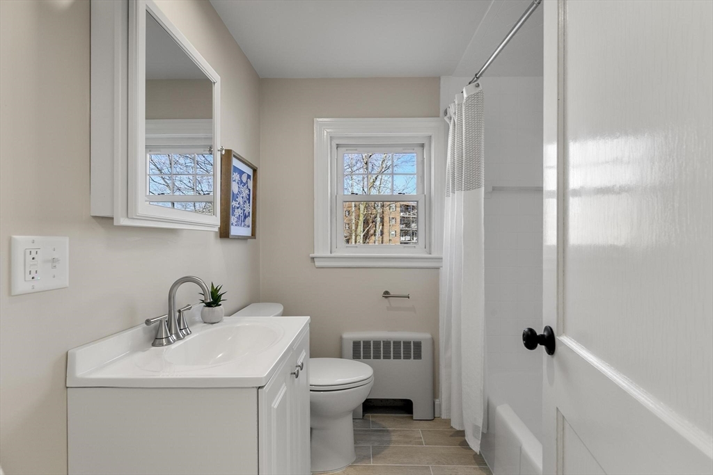 8 Crosby Road Reading, MA 01867 - Photo 17 of 30 a bathroom with a toilet sink and mirror
